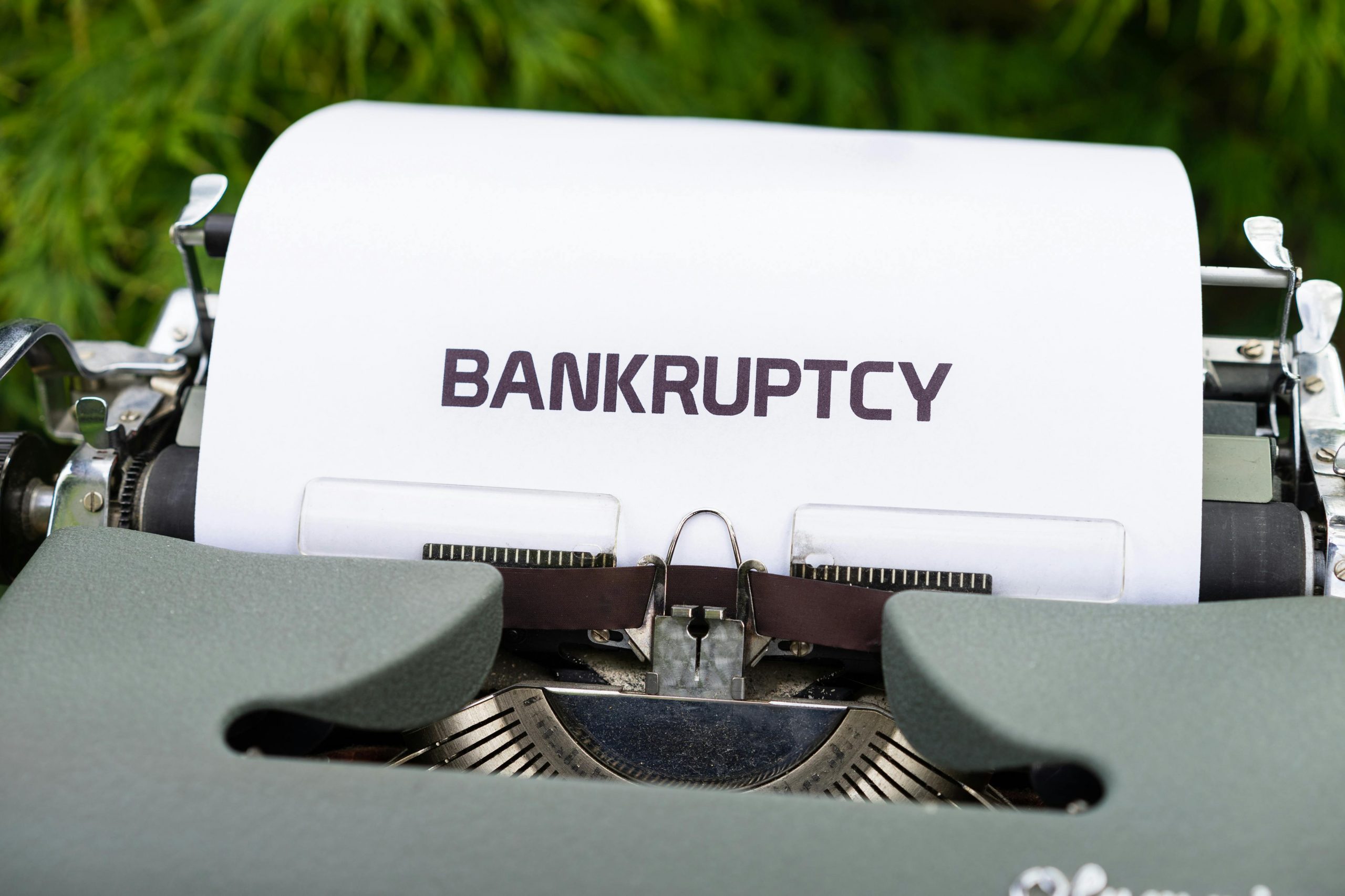 sheet of paper with the word "bankruptcy" in a typewriter